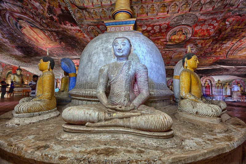 Dambulla Cave Temples with golden Buddha statues.